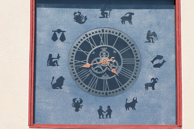 tower clock with zodiac simbols