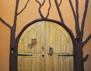 woodoen door with dragon head and hand
