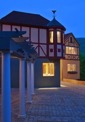 Bavarian style village with a couble stone square that has four white columns.